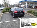 Alternative Product Image: Black car parked poorly across parking lines at a gas station, with a "You Parked Like a Moron" card attached.