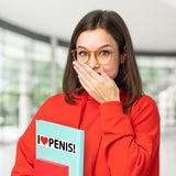 Alternative Product Image: Woman looking surprised holding a book with "I [heart] P*NIS!" on it. It appears to be a gag gift.
