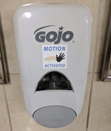 Alternative Product Image: "MOTION ACTIVATED" prank sticker on a GOJO soap dispenser.