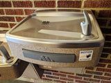 Alternative Product Image: "MOTION ACTIVATED" prank sticker on a water fountain.