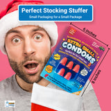 Alternative product image: Man in a Santa hat looking surprised with the Extra Small Condoms gag gift in a stocking, showing sizing.