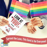 Alternative Product Image: Hands holding a "LOOK AT YOU! Getting All Married and sh*t" card with two small rainbow flags in the background. The individuals holding the flags appear to be wearing wedding rings. This could suggest a same-sex marriage.